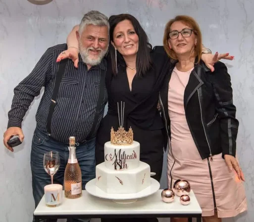 Three members of the serbian community centre at a birthday party