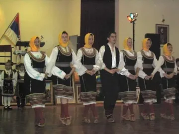 Adult dancers performing a traditional serbian tradition at the serbian centre in maddington