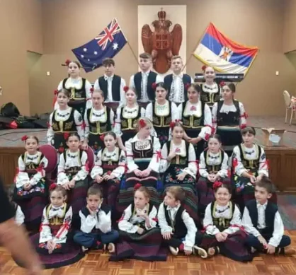 A group of young serbian children preparing for a performance for serbian folklore dancing in perth